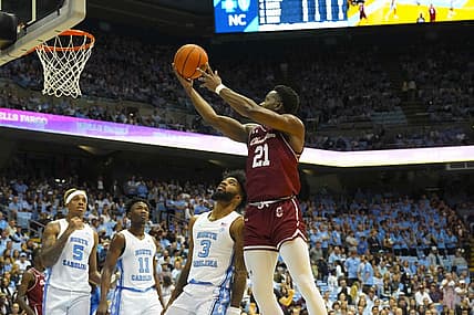 Nov 11, 2022; Chapel Hill, North Carolina, USA;  Charleston Cougars guard Jaylon Scott (21) goes to the basket against North Carolina Tar Heels guard Dontrez Styles (3) during the first half at Dean E. Smith Center. Mandatory Credit: James Guillory-USA TODAY Sports