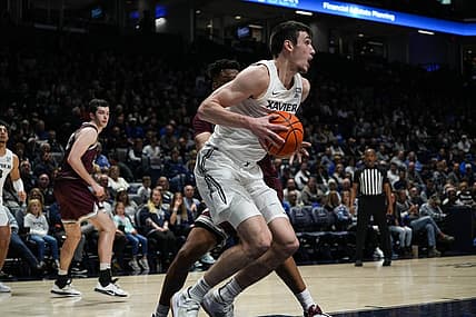 Xavier's Zach Freemantle recieves the ball under the hoop during the Xavier Musketeers vs. Montana Grizzlies game at the Cintas Center on Friday Nov. 11, 2022. The Musketeers lead the game 49-37 at halftime.