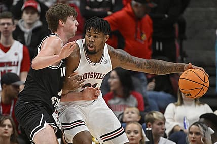 Nov 12, 2022; Louisville, Kentucky, USA;  Louisville Cardinals forward Sydney Curry (21) posts up against Wright State Raiders center AJ Braun (12) during the first half at KFC Yum! Center. Mandatory Credit: Jamie Rhodes-USA TODAY Sports