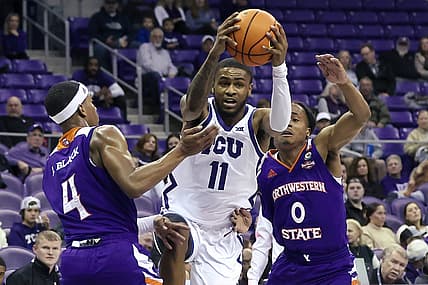 Nov 14, 2022; Fort Worth, Texas, USA;  TCU Horned Frogs guard Rondel Walker (11) drives to the basket as Northwestern State Demons guard JaMonta' Black (4) and Northwestern State Demons guard Demarcus Sharp (0) defend during the first half at Ed and Rae Schollmaier Arena. Mandatory Credit: Kevin Jairaj-USA TODAY Sports