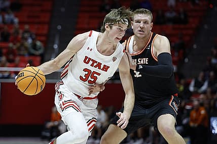 Nov 14, 2022; Salt Lake City, Utah, USA; Utah Utes center Branden Carlson (35) drives against Idaho State Bengals center Kolby Lee (32) in the second half at Jon M. Huntsman Center. Mandatory Credit: Jeffrey Swinger-USA TODAY Sports