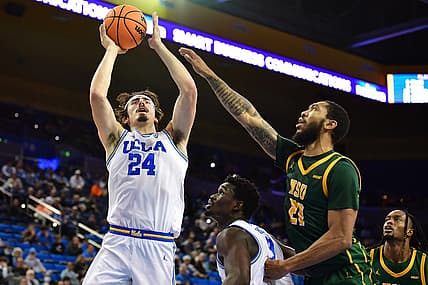 Nov 14, 2022; Los Angeles, California, USA; UCLA Bruins guard Jaime Jaquez Jr. (24) shoots against Norfolk State Spartans forward Dana Tate Jr. (21) during the first half at Pauley Pavilion. Mandatory Credit: Gary A. Vasquez-USA TODAY Sports