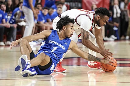 Nov 15, 2022; Queens, New York, USA;  St. John's Red Storm guard Posh Alexander (0) and Central Connecticut State Blue Devils guard Jay Rodgers (1) fight for a loose ball in the first half at Carnesecca Arena. Mandatory Credit: Wendell Cruz-USA TODAY Sports