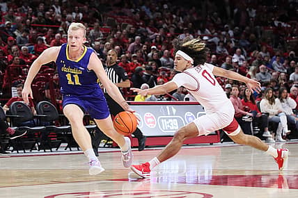 Nov 16, 2022; Fayetteville, Arkansas, USA; Arkansas Razorbacks guard Anthony Black (0) steals the ball from South Dakota State Jackrabbits guard Matthew Mors (11) in the first half at Bud Walton Arena. Mandatory Credit: Nelson Chenault-USA TODAY Sports