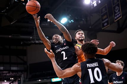Cincinnati Bearcats guard Landers Nolley II (2) competes for a rebound against Northern Kentucky Norse guard Trey Robinson (1) in the second half during a college basketball game, Wednesday, Nov. 16, 2022, at Truist Arena in Highland Heights, Ky. The Northern Kentucky Norse won, 64-51.

Cincinnati Bearcats At Northern Kentucky Norse Nov 16 0057