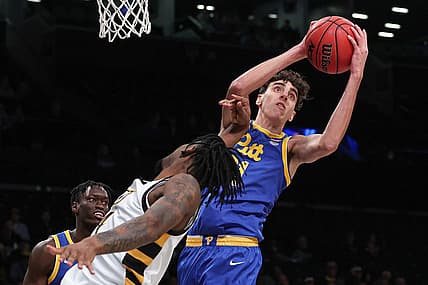 Nov 17, 2022; Brooklyn, New York, USA; Pittsburgh Panthers forward Jorge Diaz Graham (31) rebounds against Virginia Commonwealth Rams forward Jalen DeLoach (4) during the second half at Barclays Center. Mandatory Credit: Vincent Carchietta-USA TODAY Sports