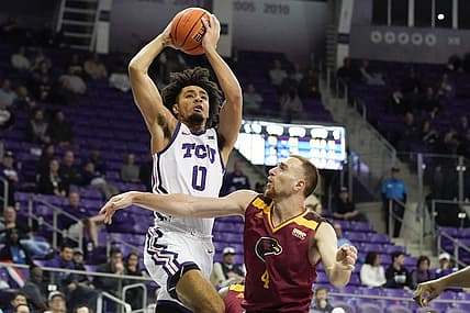 Nov 17, 2022; Fort Worth, Texas, USA; TCU Horned Frogs guard Micah Peavy (0) drives to the basket on Louisiana Monroe Warhawks forward Nika Metskhvarishvili (4) during the second half at Ed and Rae Schollmaier Arena. Mandatory Credit: Raymond Carlin III-USA TODAY Sports