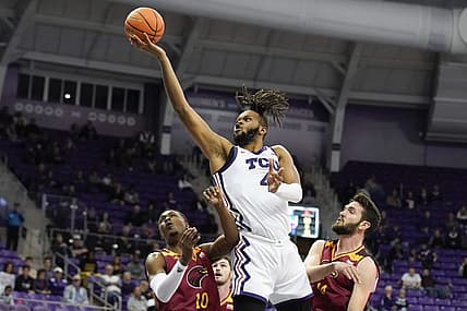Nov 17, 2022; Fort Worth, Texas, USA; TCU Horned Frogs center Eddie Lampkin Jr. (4) shoots over Louisiana Monroe Warhawks guard Langston Powell (10) and forward Victor Bafutto (14) during the second half at Ed and Rae Schollmaier Arena. Mandatory Credit: Raymond Carlin III-USA TODAY Sports
