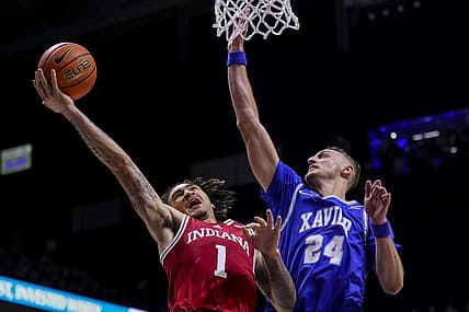 Nov 18, 2022; Cincinnati, Ohio, USA; Indiana Hoosiers guard Jalen Hood-Schifino (1) drives to the basket against Xavier Musketeers forward Jack Nunge (24) in the first half at Cintas Center. Mandatory Credit: Katie Stratman-USA TODAY Sports