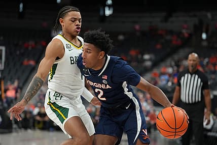 Nov 18, 2022; Las Vegas, Nevada, USA; Virginia Cavaliers guard Reece Beekman (2) dribbles against Baylor Bears guard Keyonte George (1) during the first half at T-Mobile Arena. Mandatory Credit: Stephen R. Sylvanie-USA TODAY Sports