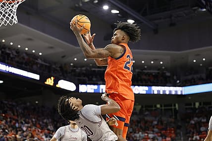 Nov 18, 2022; Auburn, Alabama, USA;  Auburn Tigers guard Allen Flanigan (22) shoots over Texas Southern Tigers guard Kehlin Farooq (20) during the second half at Neville Arena. Mandatory Credit: John Reed-USA TODAY Sports