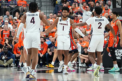 Nov 20, 2022; Las Vegas, Nevada, USA; Virginia Cavaliers forward Jayden Gardner (1) celebrates with Virginia Cavaliers guard Armaan Franklin (4) and Virginia Cavaliers guard Reece Beekman (2) after making a play against the Illinois Fighting Illini during the first half at T-Mobile Arena. Mandatory Credit: Stephen R. Sylvanie-USA TODAY Sports