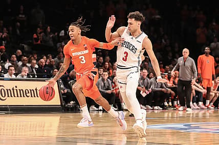 Nov 21, 2022; Brooklyn, New York, USA;  Syracuse Orange guard Judah Mintz (3) drives past Richmond Spiders forward Tyler Burton (3) in the first half at Barclays Center. Mandatory Credit: Wendell Cruz-USA TODAY Sports