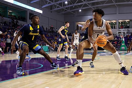 Nov 21, 2022; Fort Myers, Florida, USA;  Mississippi State Bulldogs forward Tolu Smith (1) drives to the basket defended by Marquette Golden Eagles guard Kam Jones (1) in the second half during the Fort Myers Tip-off at Suncoast Credit Union Arena. Mandatory Credit: Nathan Ray Seebeck-USA TODAY Sports
