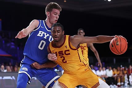 Nov 23, 2022; Paradise Island, BAHAMAS; USC Trojans guard Reese Dixon-Waters (2) dribbles as Brigham Young Cougars forward Noah Waterman (0) defends during the first half at Imperial Arena. Mandatory Credit: Kevin Jairaj-USA TODAY Sports