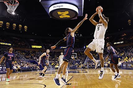 Nov 23, 2022; Ann Arbor, Michigan, USA;  Michigan Wolverines forward Terrance Williams II (5) shoots  defended by Jackson State Tigers forward Trace Young (3) in the first half at Crisler Center. Mandatory Credit: Rick Osentoski-USA TODAY Sports