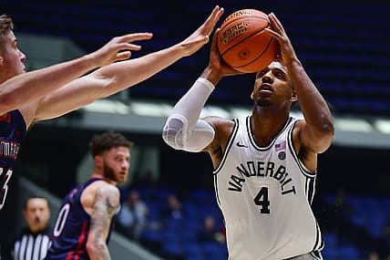 Nov 23, 2022; Anaheim, California, USA; Vanderbilt Commodores guard Jordan Wright (4) moves to the basket against St. Mary's Gaels guard Leemet Bockler (23) during the second half at Anaheim Convention Center. Mandatory Credit: Gary A. Vasquez-USA TODAY Sports