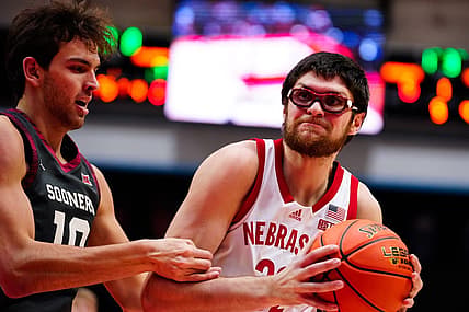 Nov 24, 2022; Orlando, Florida, USA; Nebraska Cornhuskers forward Oleg Kojenets (33) battles for possession with Oklahoma Sooners forward Yaya Keita (11) during the first half at State Farm Field House. Mandatory Credit: Rich Storry-USA TODAY Sports