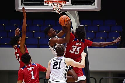 Nov 24, 2022; Anaheim, California, USA; Vanderbilt Commodores guard Graham Calton (22) moves to the basket against Fresno State Bulldogs center Eduardo Andre (35) during the first half at Anaheim Convention Center. Mandatory Credit: Gary A. Vasquez-USA TODAY Sports