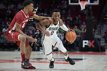 Nov 24, 2022; Portland, Oregon, USA;  Michigan State Spartans guard Tyson Walker (2) drives to the basket during the first half against Alabama Crimson Tide guard Rylan Griffen (3) at Moda Center. Mandatory Credit: Troy Wayrynen-USA TODAY Sports