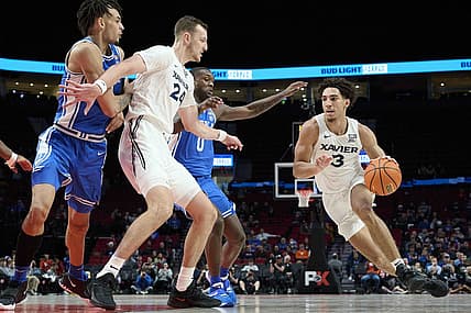 Nov 25, 2022; Portland, Oregon, USA; Xavier Musketeers guard Colby Jones (3) drives to the basket during the first half with help from teammate forward Jack Nunge (24) against Duke Blue Devils forward Dariq Whitehead (0) and center Dereck Lively II (1) at Moda Center. Mandatory Credit: Troy Wayrynen-USA TODAY Sports
