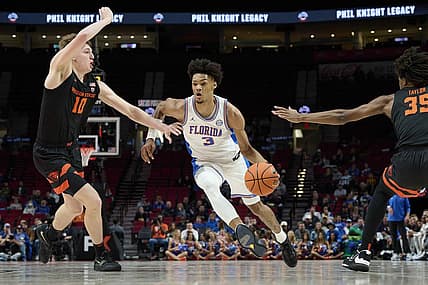 Nov 25, 2022; Portland, Oregon, USA;  Florida Gators forward Alex Fudge (3) drives past Oregon State Beavers forward Tyler Bilodeau (10) during the first half at Veterans Memorial Coliseum. Mandatory Credit: Troy Wayrynen-USA TODAY Sports