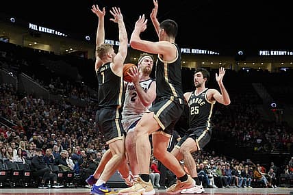 Nov 25, 2022; Portland, Oregon, USA;  Gonzaga Bulldogs forward Drew Timme (2) is triple teamed by Purdue Boilermakers forward Caleb Furst (1), center Zach Edey (15) and guard Ethan Morton (25) during the first half at Moda Center. Mandatory Credit: Troy Wayrynen-USA TODAY Sports