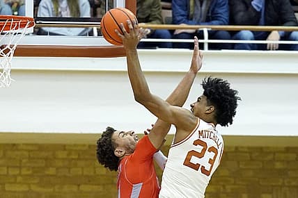 Nov 26, 2022; Austin, Texas, USA; Texas Longhorns forward Dillon Mitchell (23) shoots over Texas Rio Grande Valley Vaqueros forward Ahren Freeman (11) during the second half at Gregory Gymnasium. Mandatory Credit: Scott Wachter-USA TODAY Sports