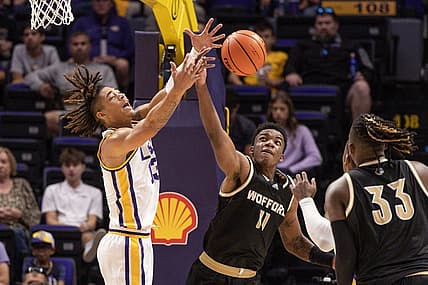 Nov 27, 2022; Baton Rouge, Louisiana, USA;  Wofford Terriers forward Amarri Tice (11) steals the ball from LSU Tigers forward Jalen Reed (13) during the first half at Pete Maravich Assembly Center. Mandatory Credit: Stephen Lew-USA TODAY Sports