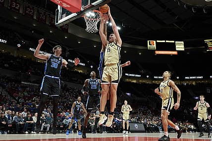 Nov 27, 2022; Portland, Oregon, USA;  Purdue Boilermakers center Zach Edey (15) dunks the ball during the first half against Duke Blue Devils center Dereck Lively II (1) at Moda Center. Purdue won the Phil Knight Legacy Championship game 75-56. Mandatory Credit: Troy Wayrynen-USA TODAY Sports