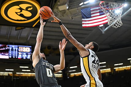 Nov 29, 2022; Iowa City, Iowa, USA; Iowa Hawkeyes forward Kris Murray (24) blocks the shot of Georgia Tech Yellow Jackets guard Lance Terry (0) during the first half at Carver-Hawkeye Arena. Mandatory Credit: Jeffrey Becker-USA TODAY Sports