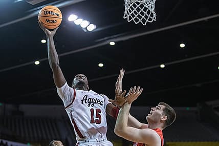 Mike Peake (15) goes up for a layup as the New Mexico State Aggies face the Dixie State Trailblazers at the Pan American Center in Las cruces on Wednesday, Feb. 16, 2022.

Nmsu Dsu 4