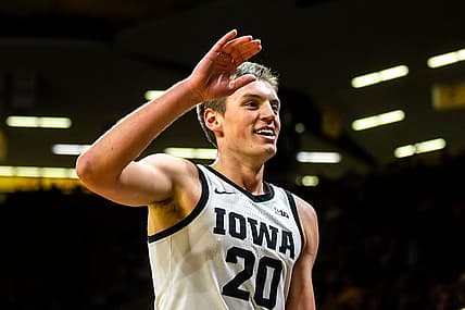 Iowa forward Payton Sandfort (20) high-fives teammates during a NCAA men's basketball game against Omaha, Monday, Nov. 21, 2022, at Carver-Hawkeye Arena in Iowa City, Iowa.

221121 Omaha Iowa Mbb 044 Jpg