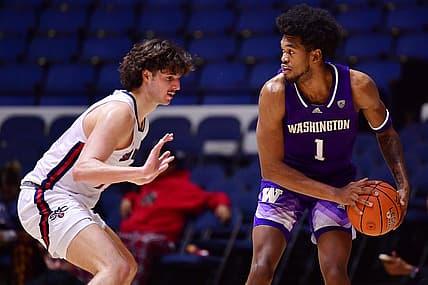 Nov 24, 2022; Anaheim, California, USA; Washington Huskies forward Keion Brooks (1) controls the ball against St. Mary's Gaels forward Kyle Bowen (14) during the second half at Anaheim Convention Center. Mandatory Credit: Gary A. Vasquez-USA TODAY Sports