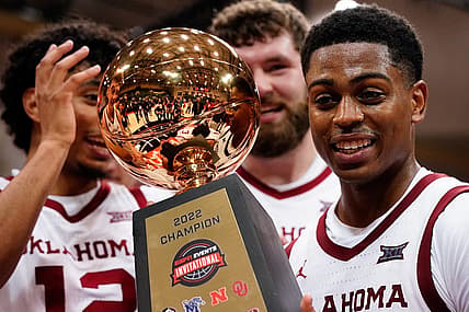 Nov 27, 2022; Orlando, FL, USA; Oklahoma Sooners guard Grant Sherfield (25) holds the ESPN Invitational Trophy after defeating the Mississippi Rebels at ESPN Wide World of Sports. Mandatory Credit: Rich Storry-USA TODAY Sports