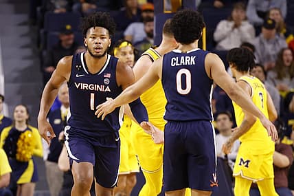 Nov 29, 2022; Ann Arbor, Michigan, USA; Virginia Cavaliers forward Jayden Gardner (1) receives congratulations from guard Kihei Clark (0) in the first half against the Michigan Wolverines at Crisler Center. Mandatory Credit: Rick Osentoski-USA TODAY Sports