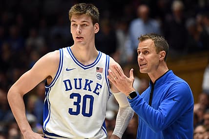 Nov 30, 2022; Durham, North Carolina, USA; Duke Blue Devils head coach Jon Scheyer (right) gives instructions to center Kyle Filipowski(30)  during the second half against the Ohio State Buckeyes at Cameron Indoor Stadium.  The Blue Devils won 81-72. Mandatory Credit: Rob Kinnan-USA TODAY Sports