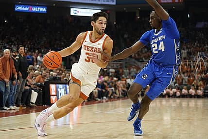 Dec 1, 2022; Austin, Texas, USA; Texas Longhorns forward Brock Cunningham (30) drives to the basket against Creighton Bluejays forward Arthur Kaluma (24) during the first half at Moody Center. Mandatory Credit: Scott Wachter-USA TODAY Sports