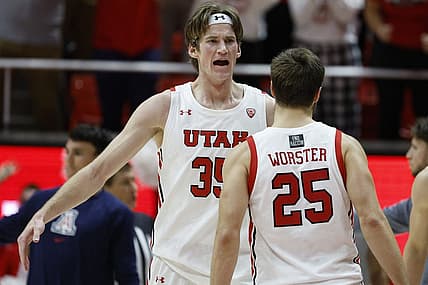 Dec 1, 2022; Salt Lake City, Utah, USA; Utah Utes center Branden Carlson (35) shows his excitement with guard Rollie Worster (25) in the second half against the Arizona Wildcats at Jon M. Huntsman Center. Mandatory Credit: Jeffrey Swinger-USA TODAY Sports