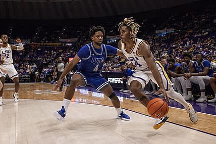 Dec 2, 2022; Baton Rouge, Louisiana, USA;  LSU Tigers guard Adam Miller (44) dribbles against Texas-Arlington Mavericks guard Kyron Gibson (4) during the first half at Pete Maravich Assembly Center. Mandatory Credit: Stephen Lew-USA TODAY Sports