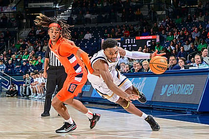 Dec 3, 2022; South Bend, Indiana, USA; Notre Dame Fighting Irish guard JJ Starling (1) dribbles as Syracuse Orange forward Chris Bell (0) defends in the first half at the Purcell Pavilion. Mandatory Credit: Matt Cashore-USA TODAY Sports