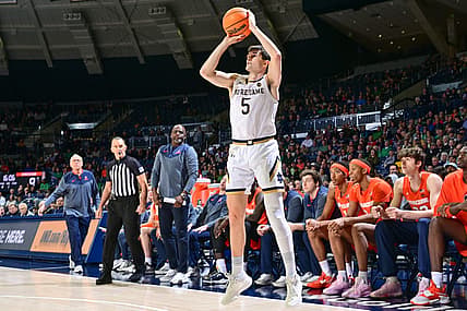 Dec 3, 2022; South Bend, Indiana, USA; Notre Dame Fighting Irish guard Cormac Ryan (5) shoots a three point basket in the first half against the Syracuse Orange at the Purcell Pavilion. Mandatory Credit: Matt Cashore-USA TODAY Sports