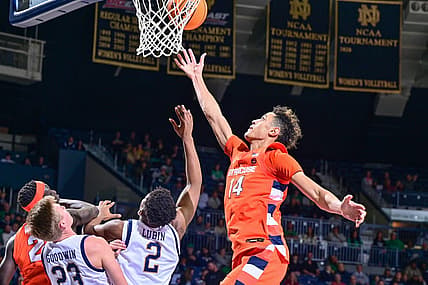 Dec 3, 2022; South Bend, Indiana, USA; Syracuse Orange center Jesse Edwards (14) reaches for a rebound over Notre Dame Fighting Irish forward Ven-Allen Lubin (2) in the second half at the Purcell Pavilion. Mandatory Credit: Matt Cashore-USA TODAY Sports