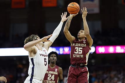 Dec 3, 2022; Charlottesville, Virginia, USA; Florida State Seminoles guard Matthew Cleveland (35) shoots the ball over Virginia Cavaliers forward Ben Vander Plas (5) in the first half at John Paul Jones Arena. Mandatory Credit: Geoff Burke-USA TODAY Sports
