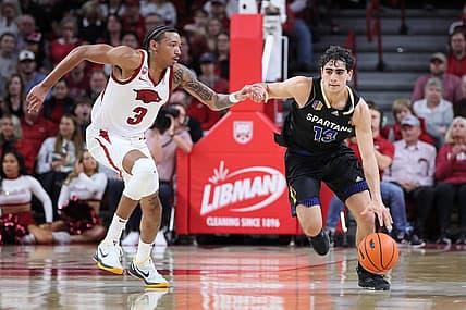 Dec 3, 2022; Fayetteville, Arkansas, USA; San Jose State Spartans guard Alvaro Cardenas (13) drives against  Arkansas Razorbacks guard Nick Smith Jr (3) during the first half at Bud Walton Arena. Mandatory Credit: Nelson Chenault-USA TODAY Sports