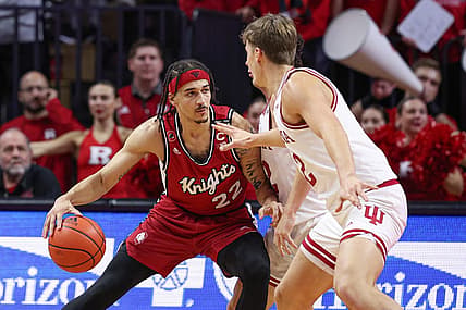 Dec 3, 2022; Piscataway, New Jersey, USA; Rutgers Scarlet Knights guard Caleb McConnell (22) dribbles against Indiana Hoosiers forward Miller Kopp (12) during the first half at Jersey Mike's Arena. Mandatory Credit: Vincent Carchietta-USA TODAY Sports