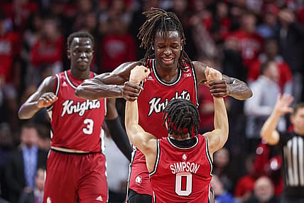 Dec 3, 2022; Piscataway, New Jersey, USA; Rutgers Scarlet Knights center Clifford Omoruyi (11) helps guard Derek Simpson (0) up after being fouled by Rutgers Scarlet Knights forward Mawot Mag (3) during the second half against the Indiana Hoosiers at Jersey Mike's Arena. Mandatory Credit: Vincent Carchietta-USA TODAY Sports