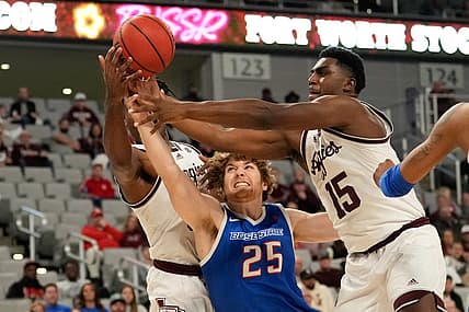 Dec 3, 2022; Fort Worth, Texas, USA;  Boise State Broncos center Lukas Milner (25) fights for a loose ball against Texas A&M Aggies forward Julius Marble (34) and forward Henry Coleman III (15) during the first half at Dickies Arena. Mandatory Credit: Chris Jones-USA TODAY Sports