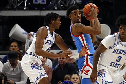 Dec 3, 2022; Memphis, Tennessee, USA; Memphis Tigers forward Chandler Lawson (4) defends Mississippi Rebels forward Robert Allen (21) during the first half at FedExForum. Mandatory Credit: Petre Thomas-USA TODAY Sports