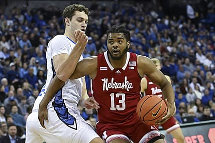 Dec 4, 2022; Omaha, Nebraska, USA;  Nebraska Cornhuskers forward Derrick Walker (13) drives against Creighton Bluejays center Ryan Kalkbrenner (11) in the first half at CHI Health Center Omaha. Mandatory Credit: Steven Branscombe-USA TODAY Sports